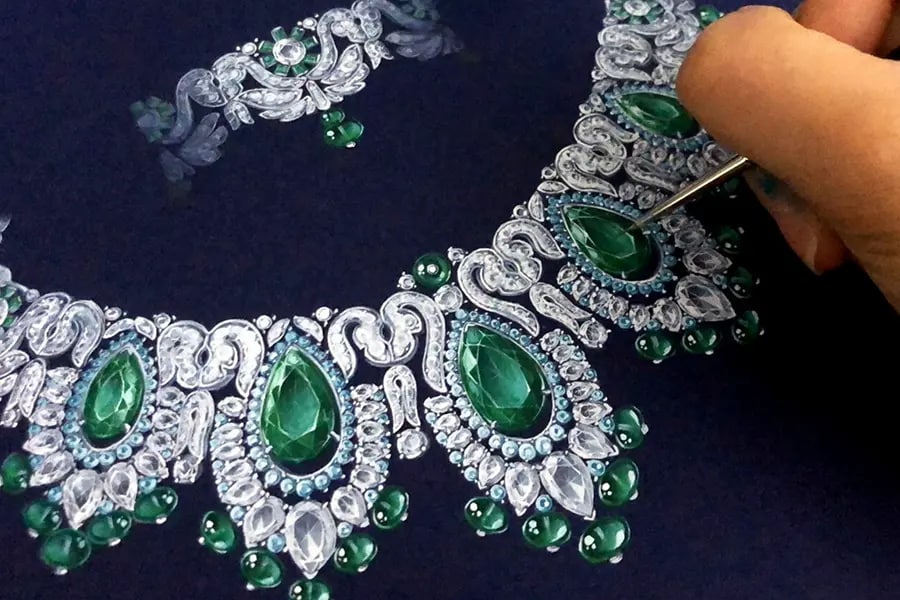 A person working on a sketch of jewellery