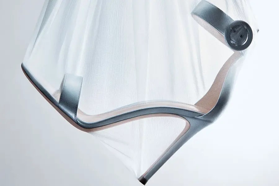 A silver high heel shoe