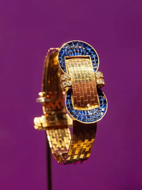 A golden ring with blue gemstones