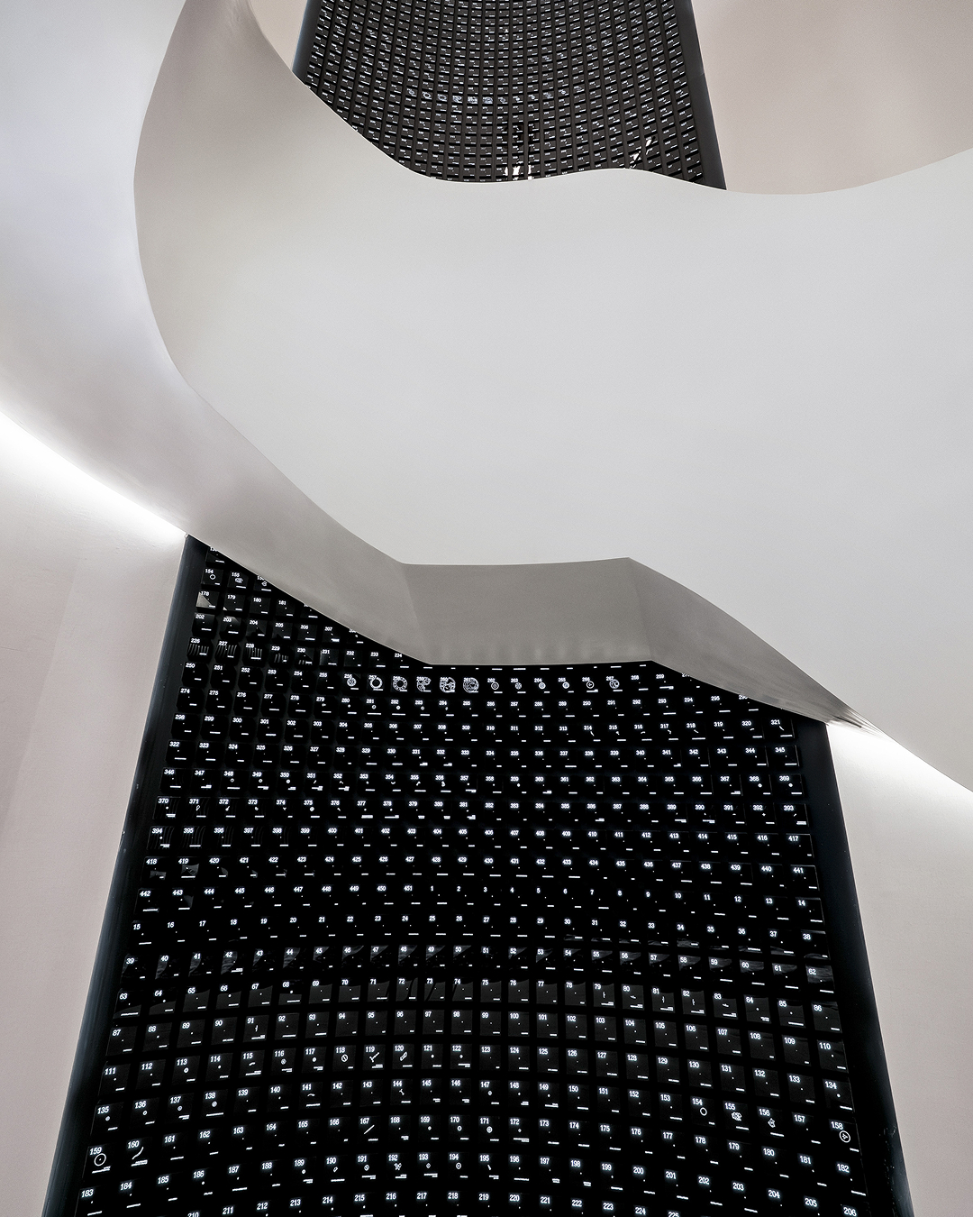 An invitation into the world of German precision watchmaking. 

A particular highlight of the boutique features the 9-metre-high “Wall of Parts”, which showcases all 451 parts of the ZEITWERK movement and connects both storeys. Its impressive height allows for a complete view of the watch’s individual components from different angles ‒ from below the stairs, while ascending and from the upper level. 

A. Lange & Söhne at ION Orchard, Singapore