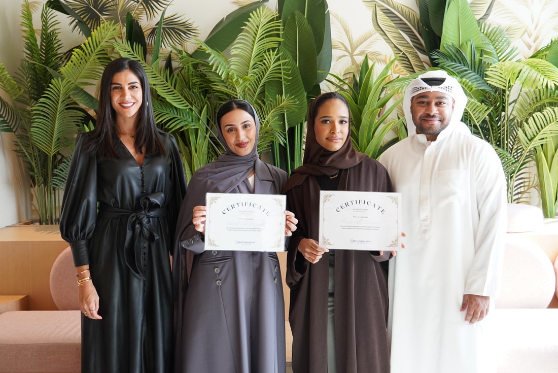 A group photo of three women and a man