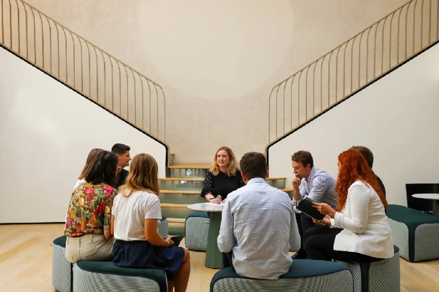 A group of people sitting and disscussing