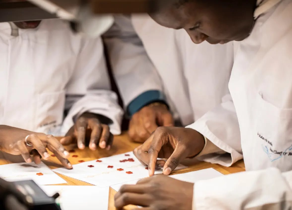 Three people in a workshop
