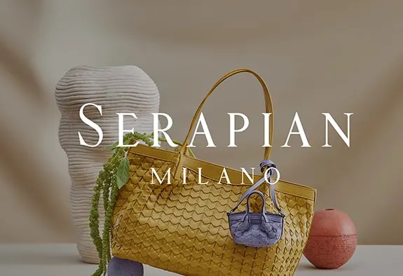 Serapian logo with a yellow bag in the background