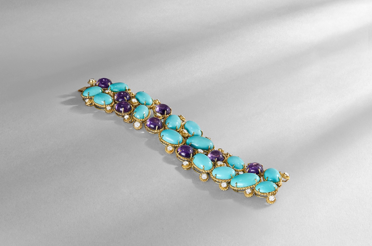 A golden bracelet with blue gemstones