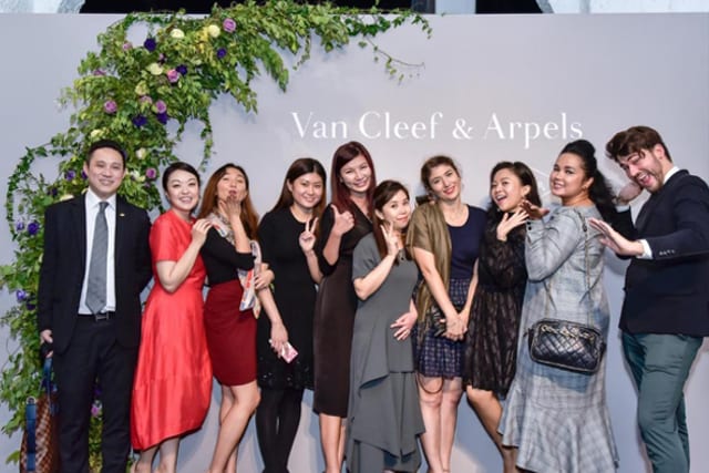 A group photo from Van Cleef & Arpels party