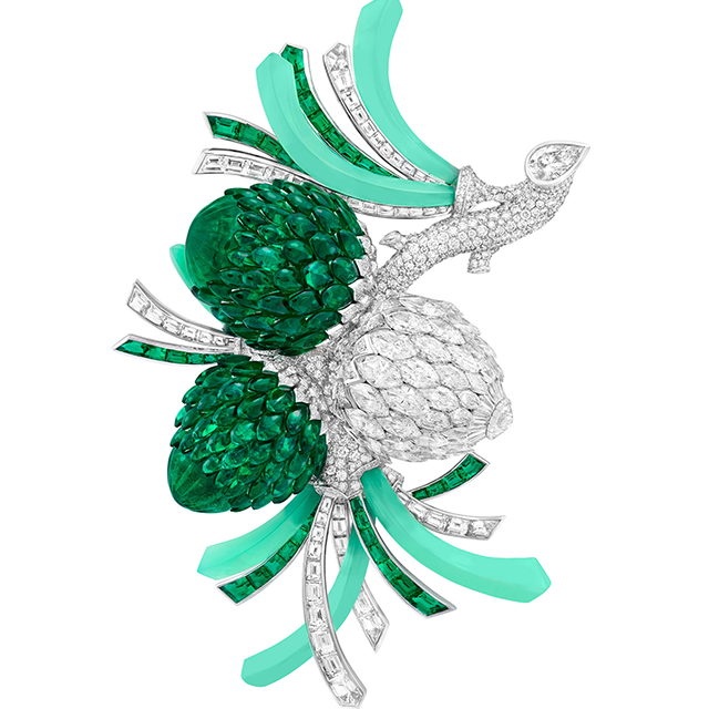 The Pomme de Pin clip, pinecones poised on a diamond branch budding with young shoots